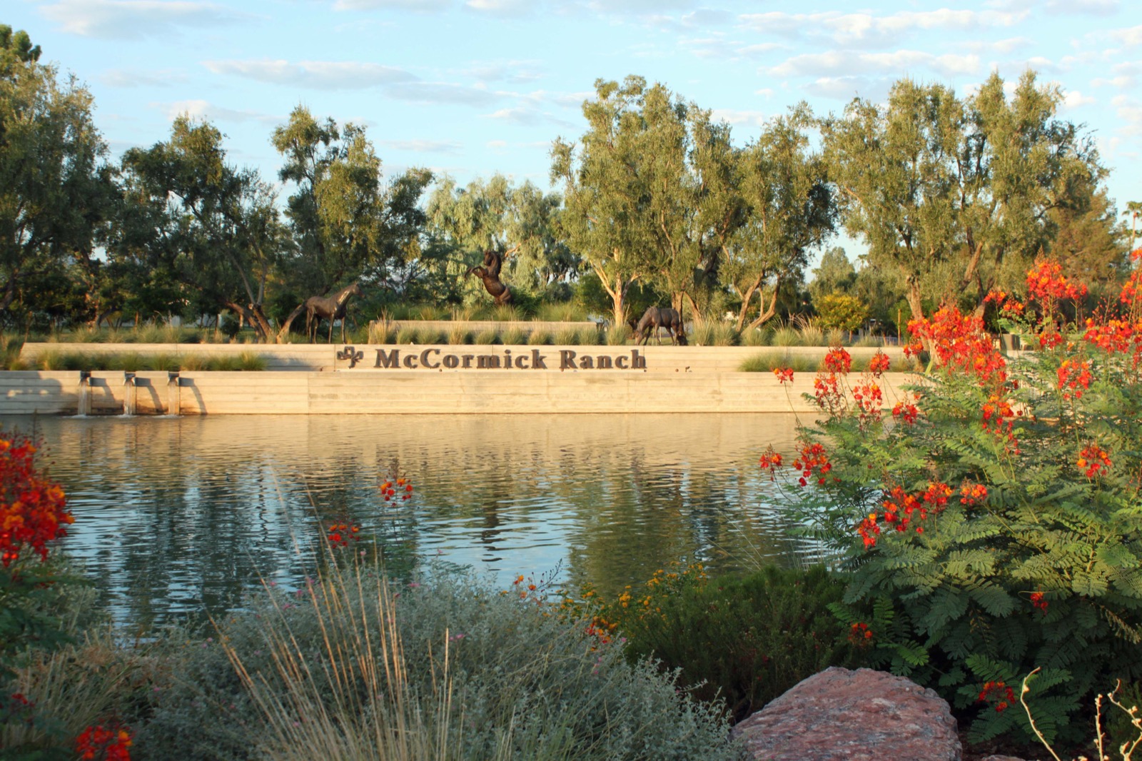 McCormick Ranch entrance on McCormick Parkway with water, trees and horse sculptures